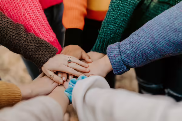 Hands coming together