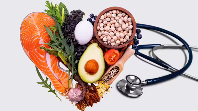 Healthy foods pictured in the shape of a heart with a stethoscope