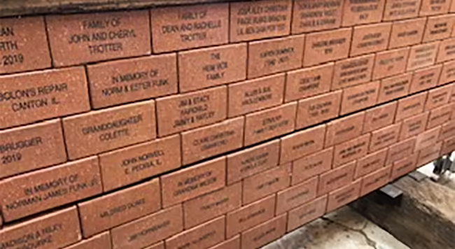 wall of engraved bricks
